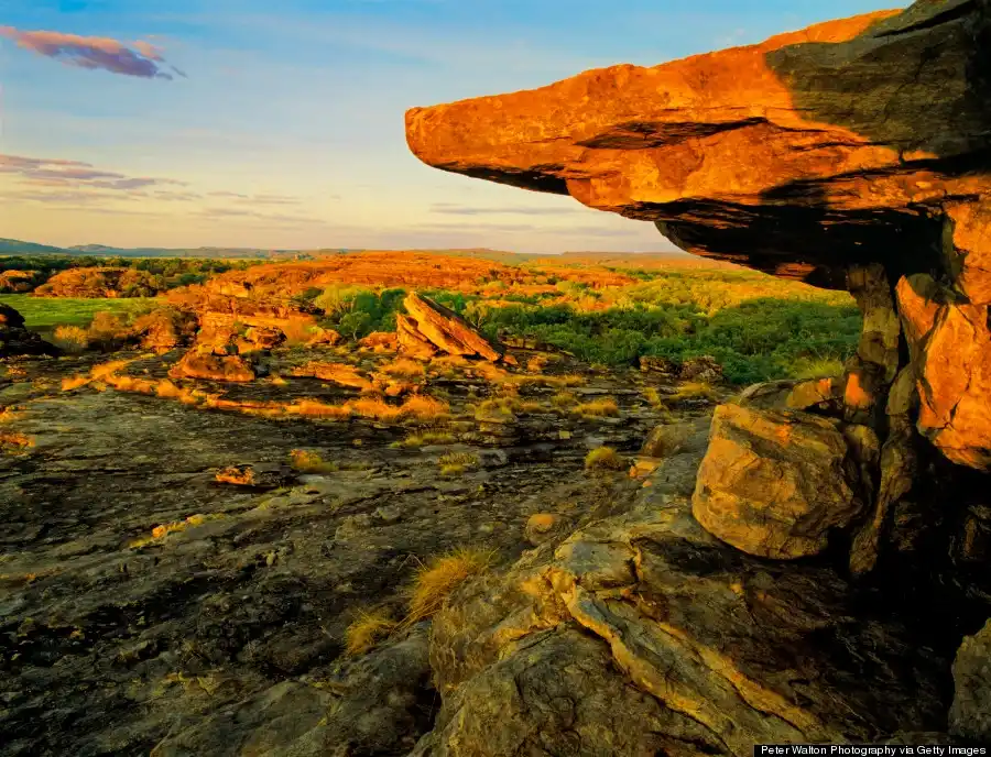 A vast national park featuring wetlands, wildlife, waterfalls, and ancient Aboriginal rock art.