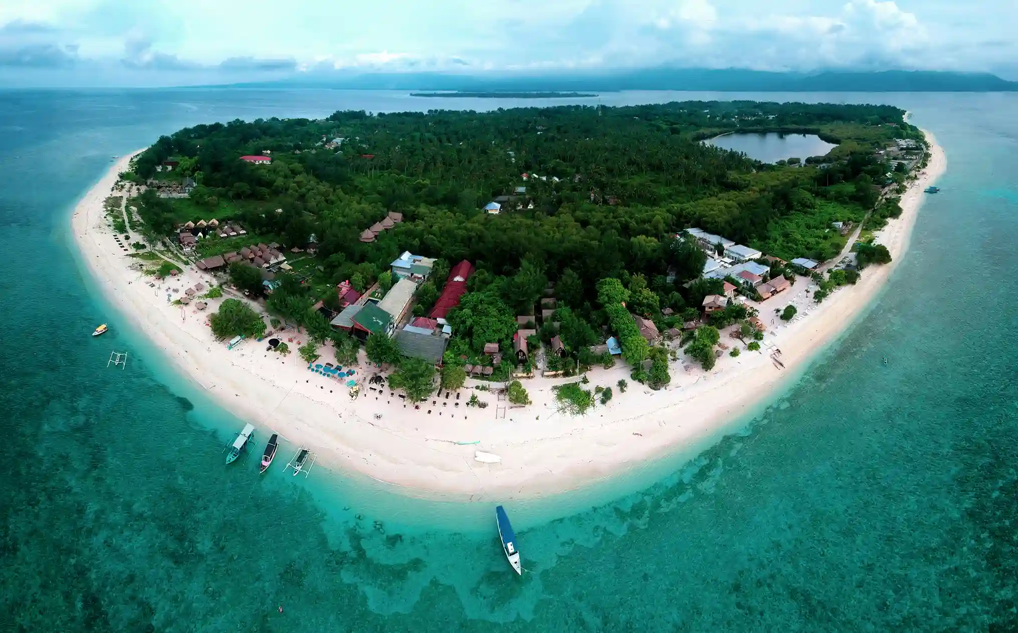 Aerial Gili Islands view with beaches and turquoise water, included by icanfly in Indonesia island getaway recommendations.