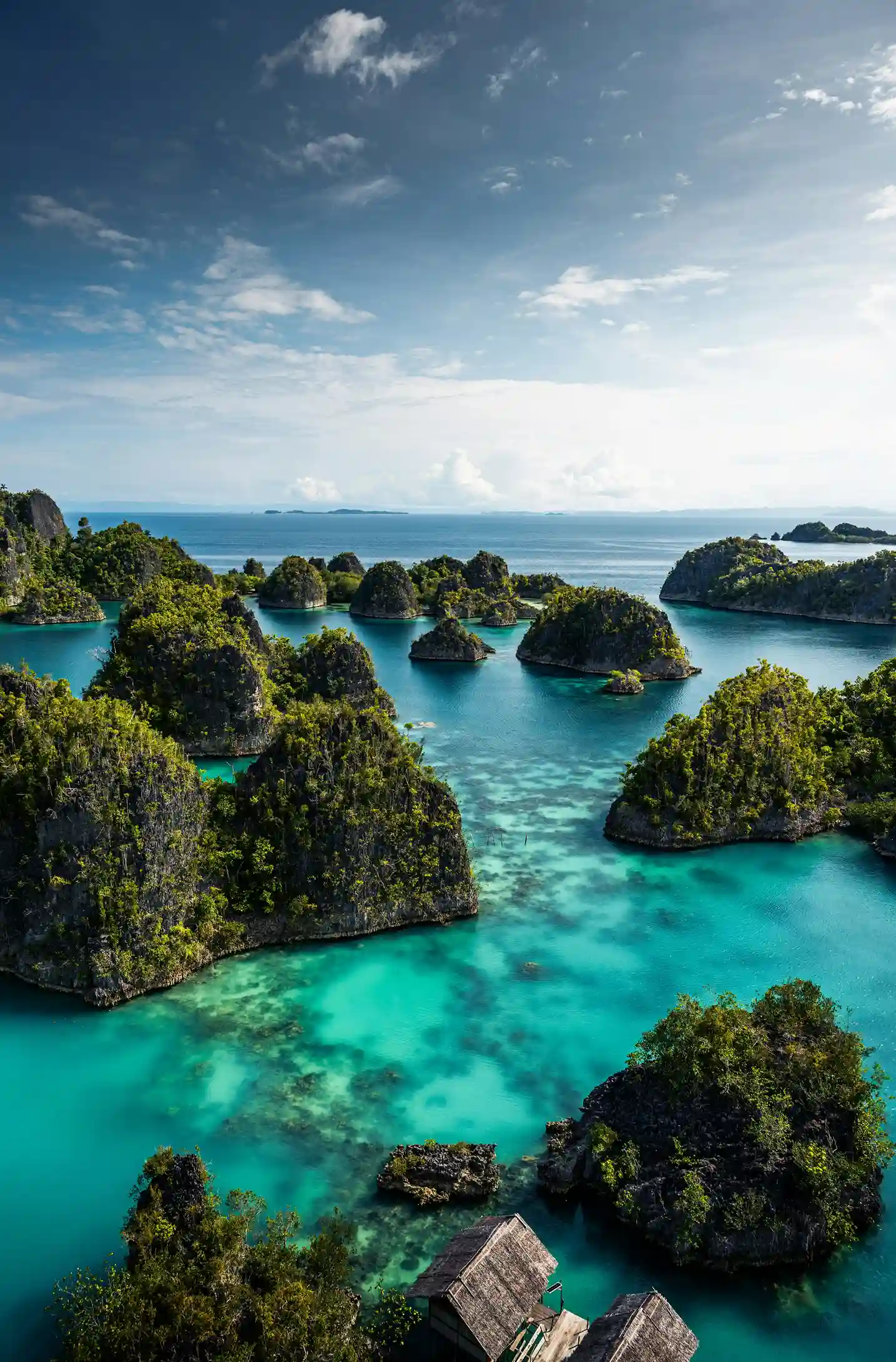 Raja Ampat’s islands and clear waters, a world-class underwater destination highlighted by icanfly for Indonesia diving travel.