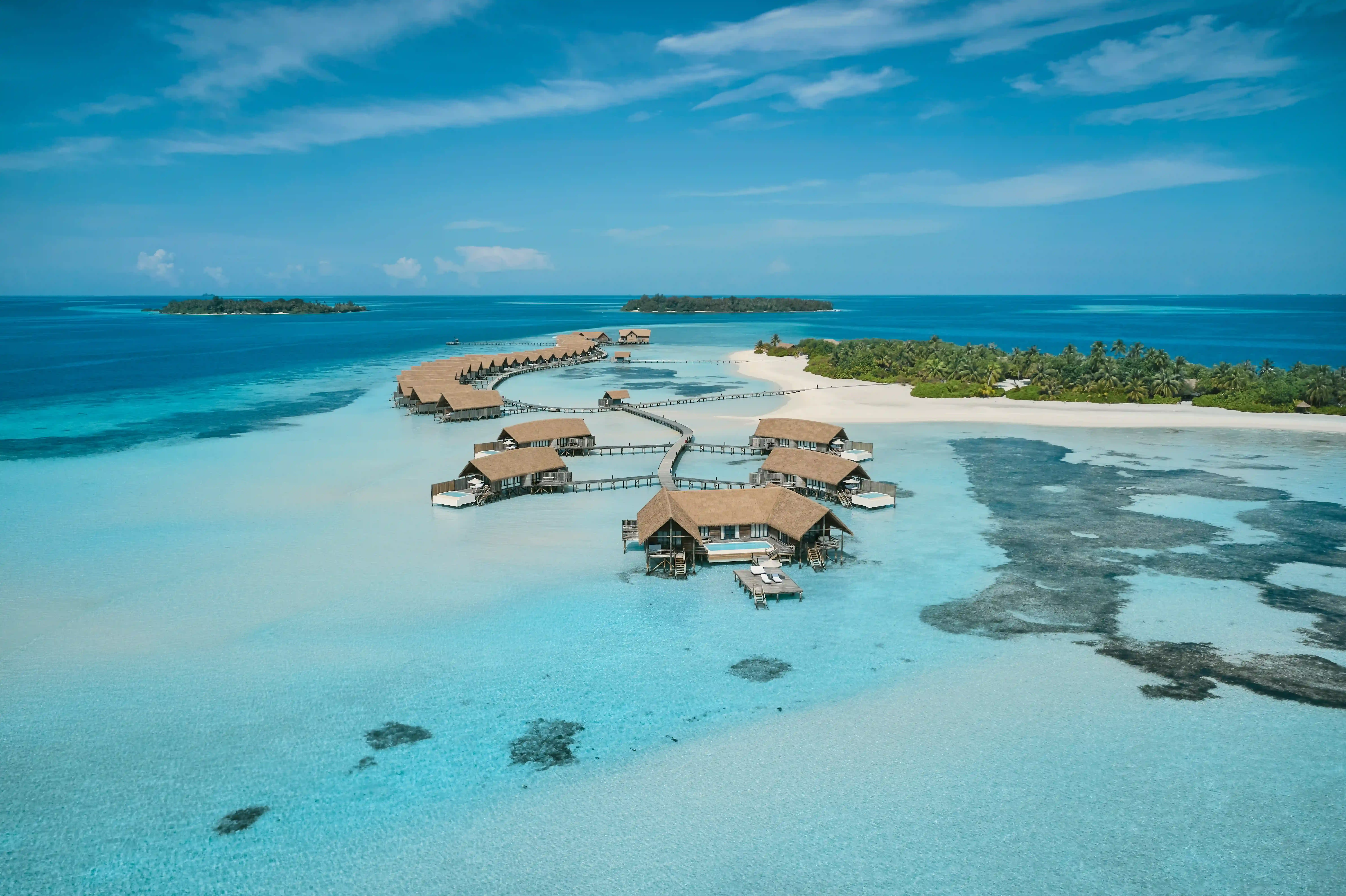 Enjoy a peaceful private island with overwater villas, calm lagoons, and crystal-clear waters -ideal for relaxation and honeymoon stays.