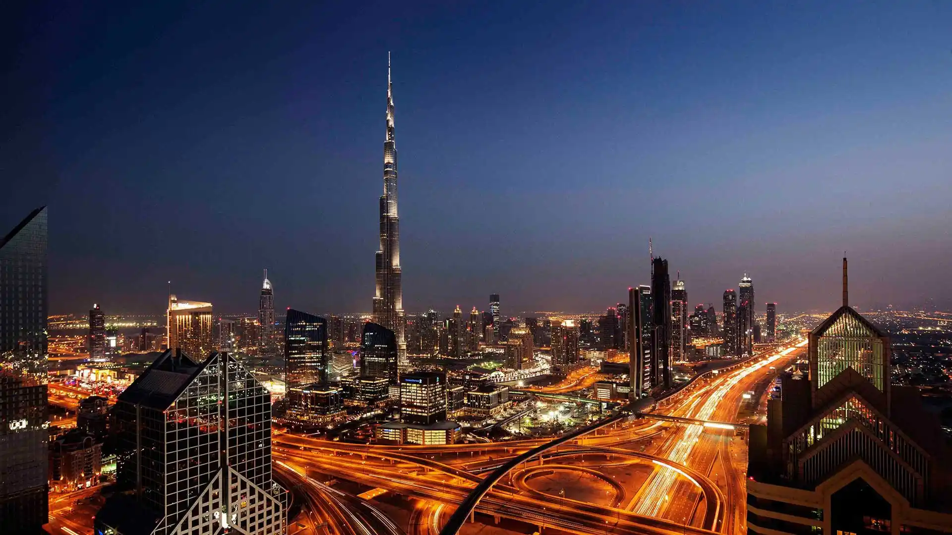 Dubai's modern architecture and luxurious lifestyle, featuring iconic attractions like the Burj Khalifa and Dubai Miracle Garden.