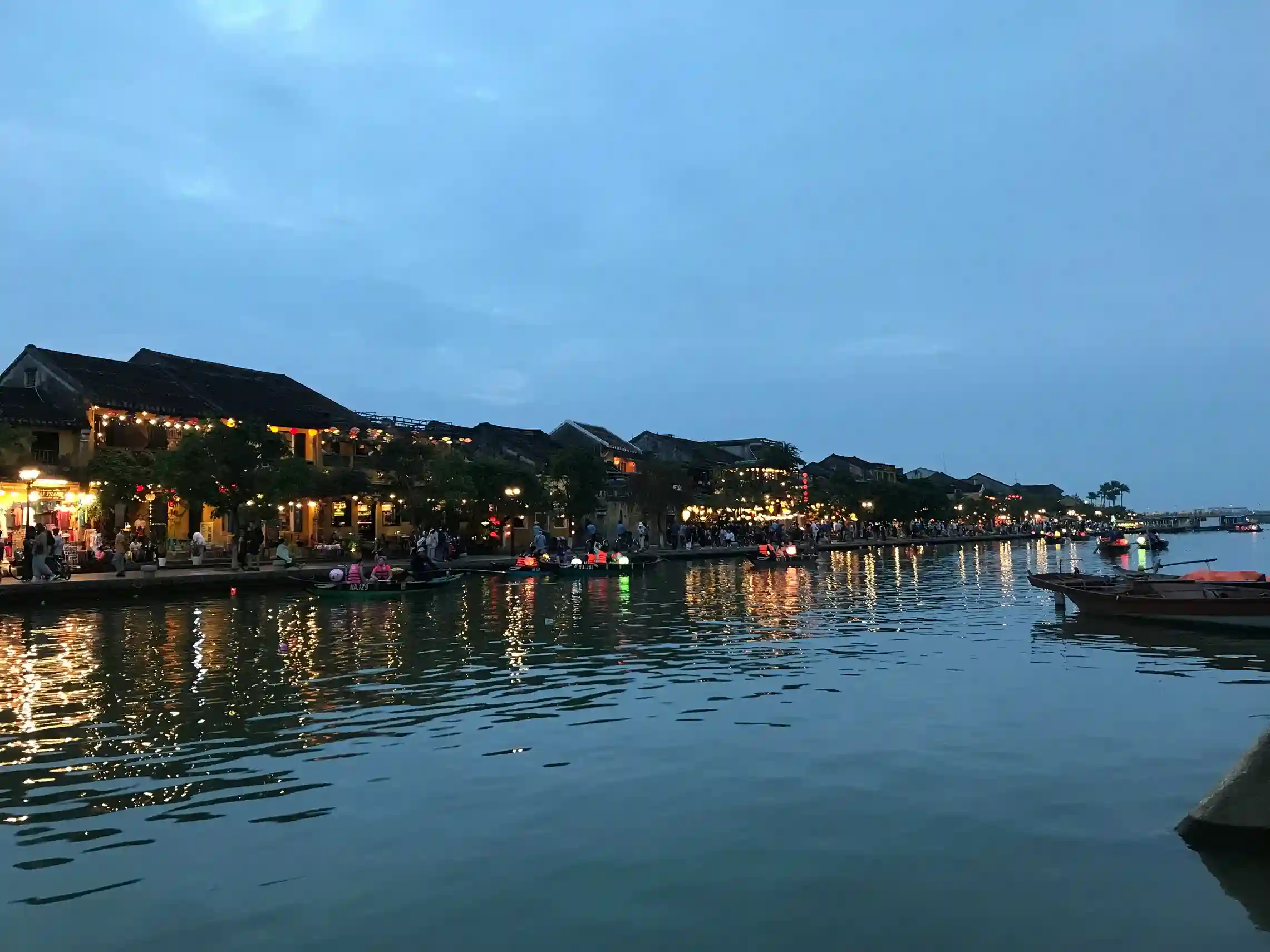 Evening Li River cruise in Guilin / Yangshuo with vibrant water reflections and karst mountains, a peaceful adventure featured by icanfly.