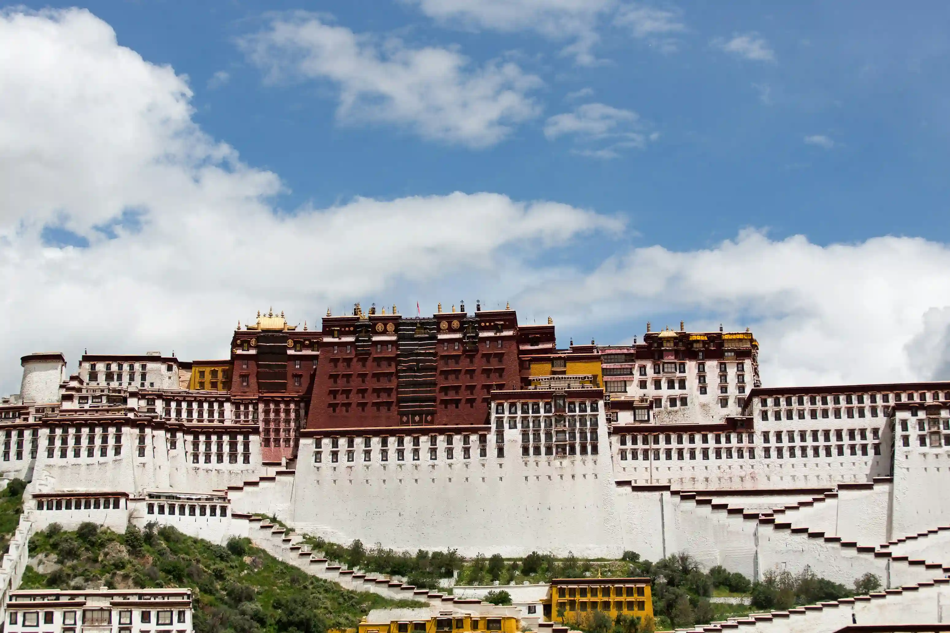 Potala Palace in Lhasa, Tibet perched above the city as a spiritual icon, showcased by icanfly for cultural and Himalayan exploration.