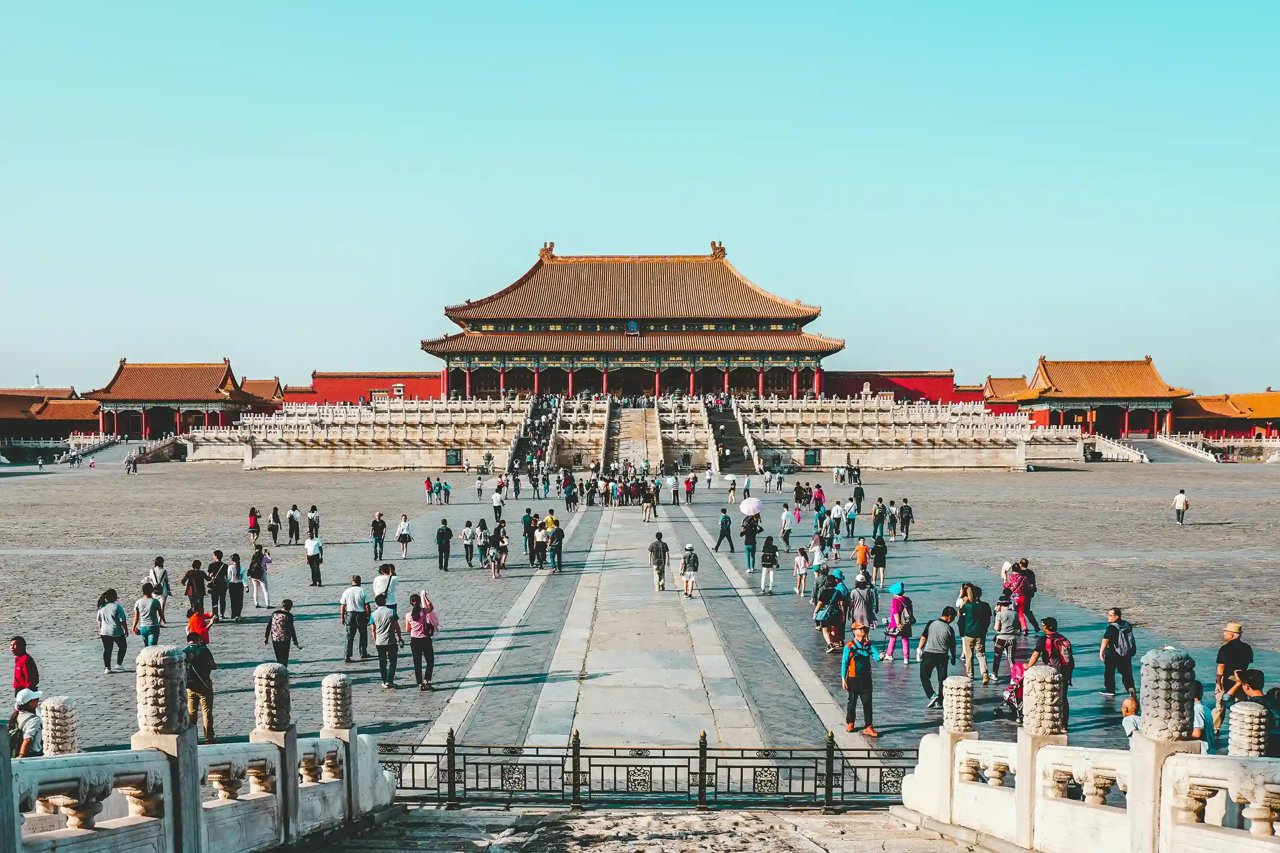Historic Forbidden City with visiting tourists in Beijing, a must-see UNESCO site highlighted by icanfly for heritage travellers.