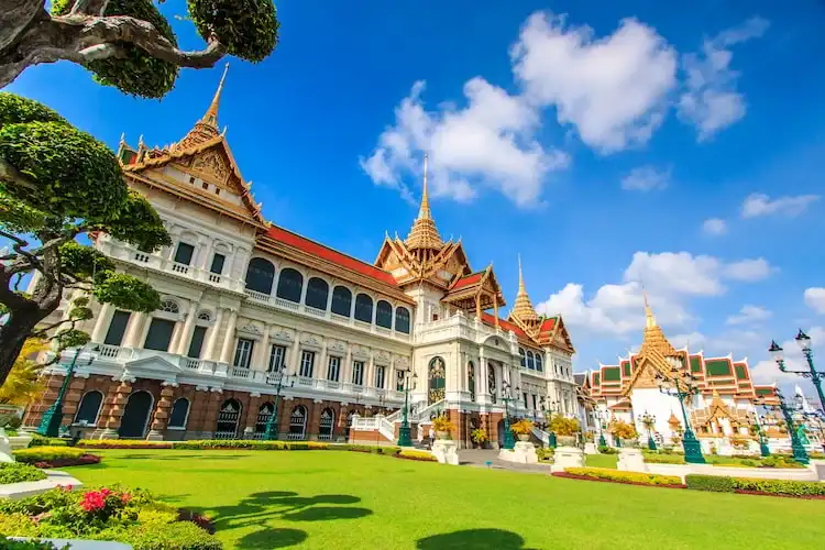 A historic royal complex in Bangkok showcasing traditional Thai architecture, temples, and cultural heritage.